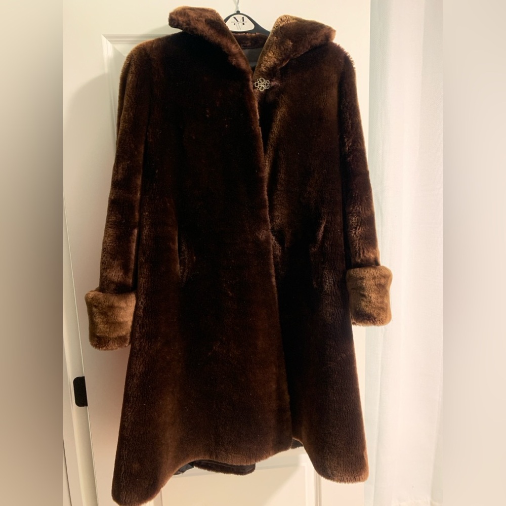 Dark brown faux fur coat, clasp closure. Heavy and warm!